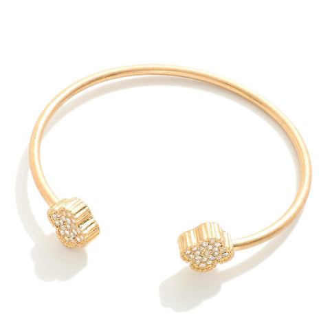 Gold cuff bracelet w/ rhinestone clover details