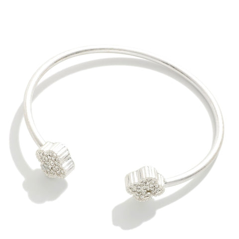 Silver cuff bracelet w/ rhinestone studded clover details
